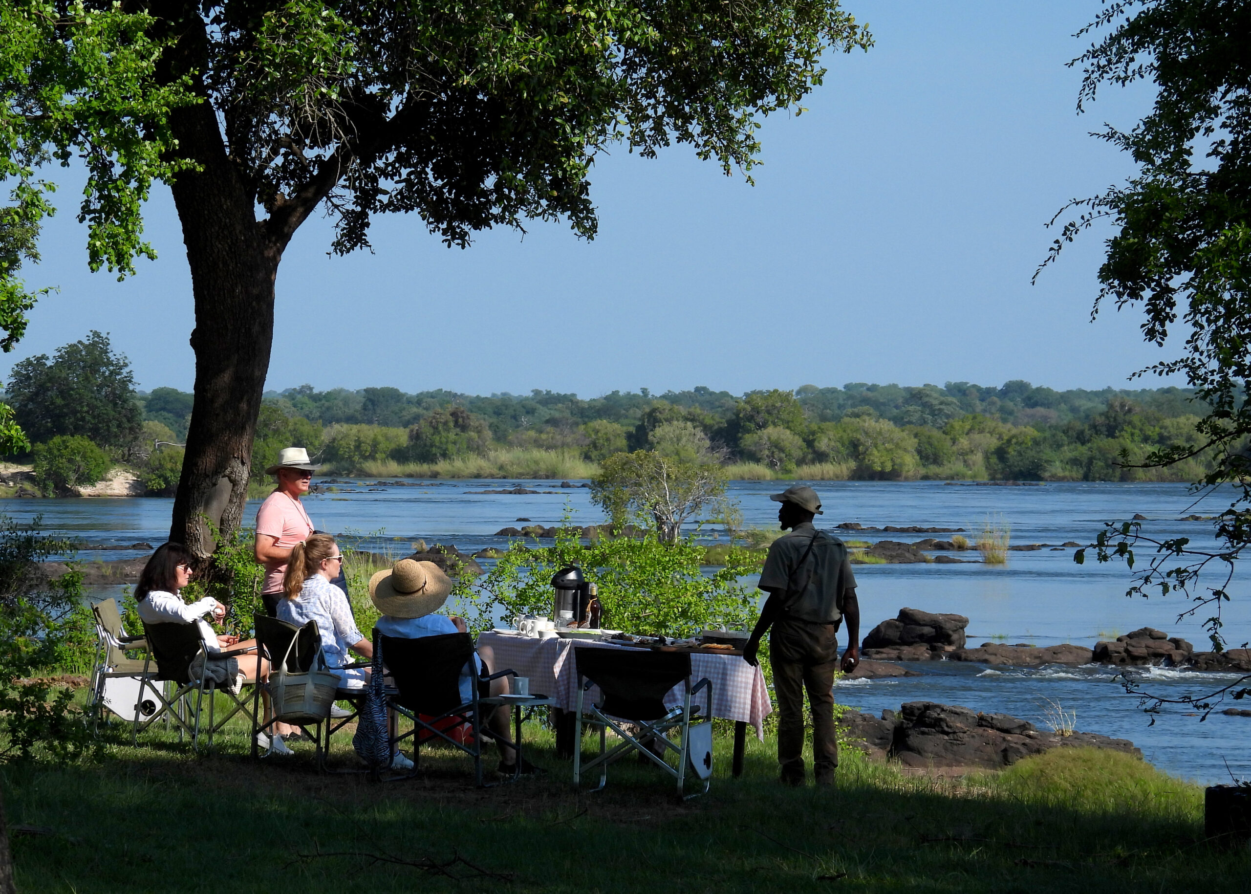 Discover Safari Guests having a picnic by the Zambezi River